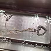 A close-up photo of an ultrasonic jewelry cleaner